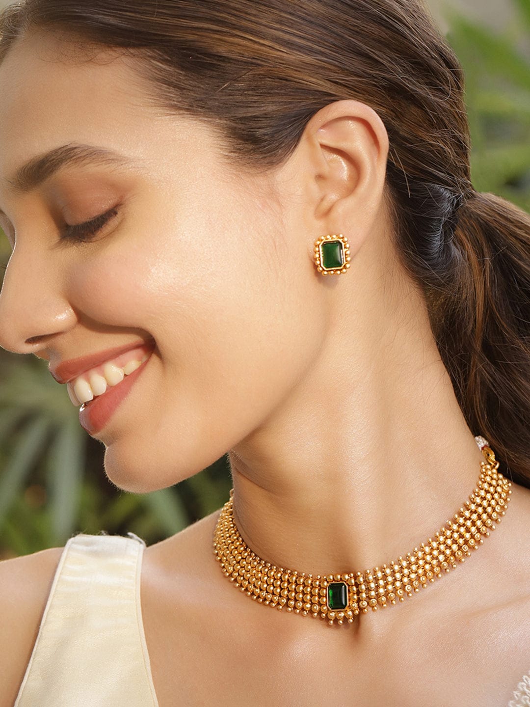 Gold Plated Brass Emerald Stone Studded Intricate Necklace With Earrings Set