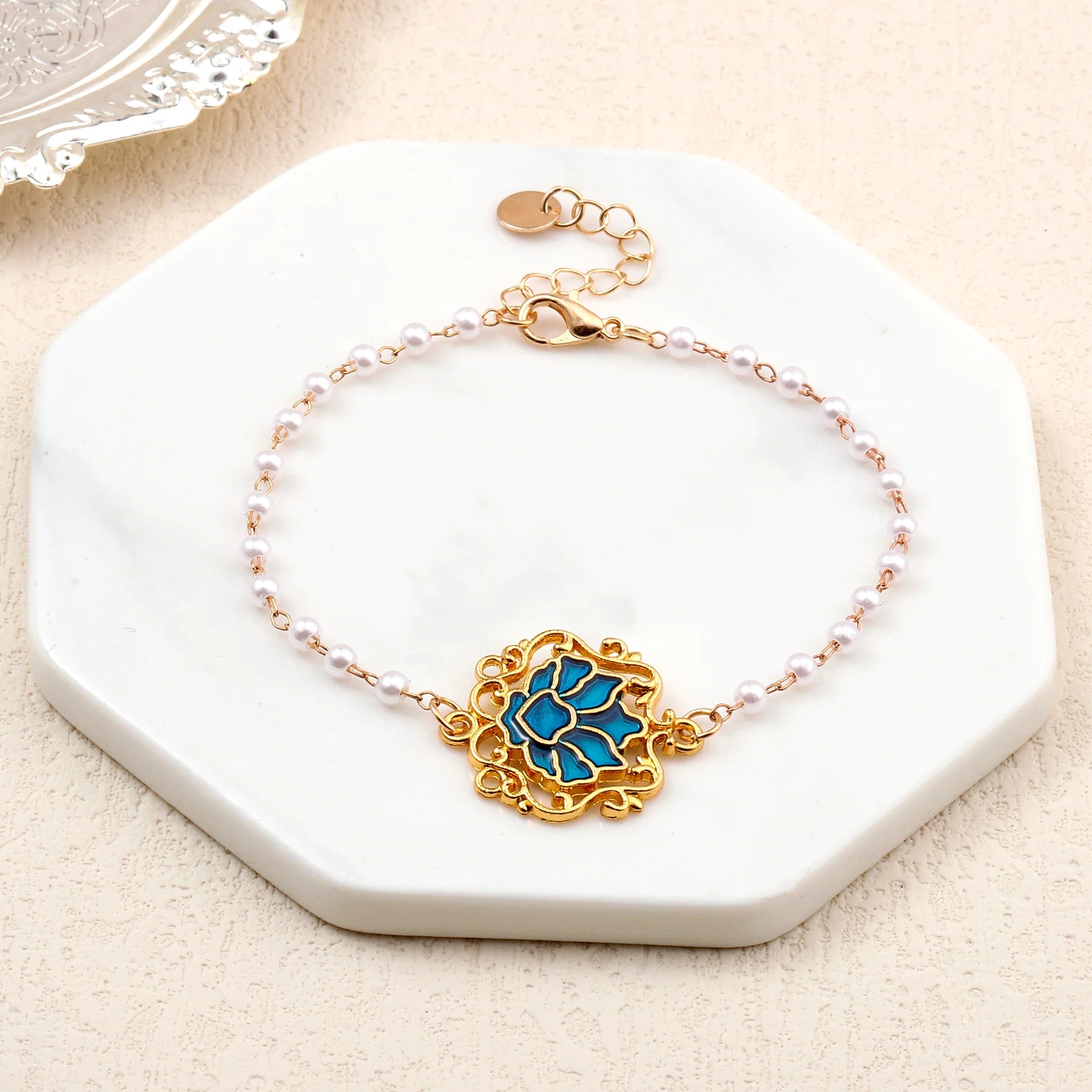 Serenity Lotus Blue Charm Gold Bracelet